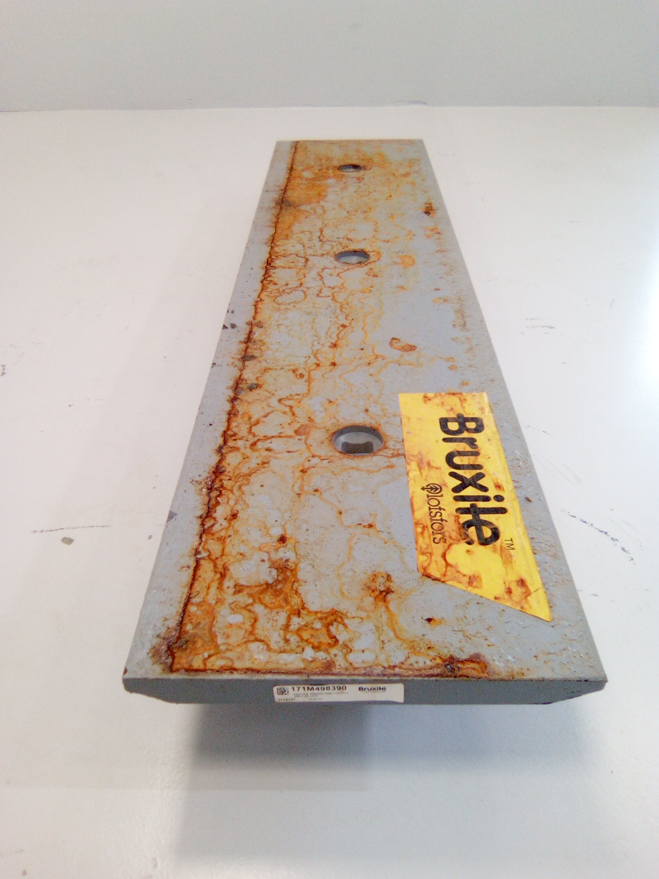 Contre lame de godet centrale reversible 3 trous en 1